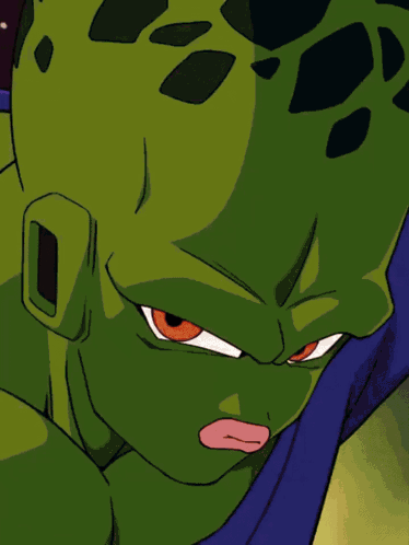 a close up of a cartoon character with a green head and red eyes