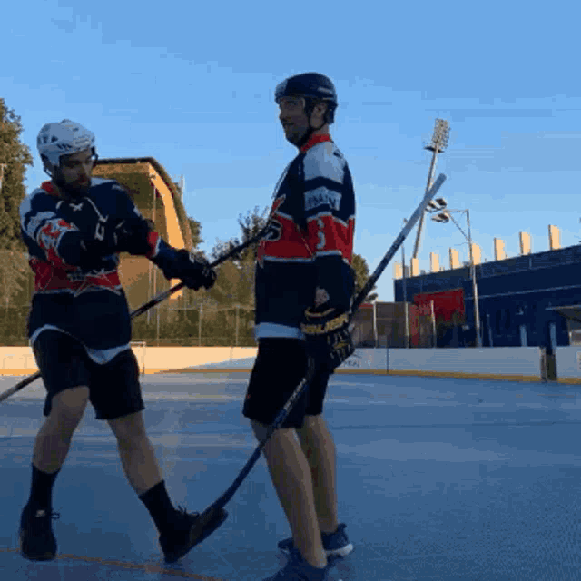 a hockey player wearing a jersey that says ' reebok ' on it