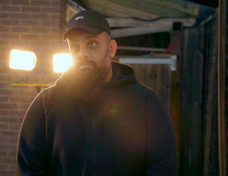 a man with a beard wearing a hat that says oreal on it