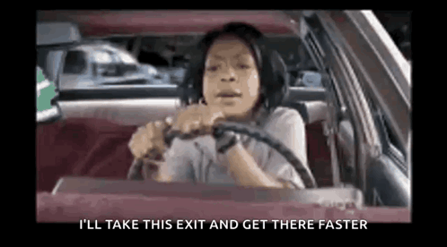 a woman is driving a car with the words `` i 'll take this exit and get there faster '' on the screen .