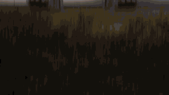 a blurred image of a landscape with trees in the foreground