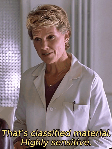a woman in a white lab coat says that 's classified material