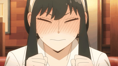 a close up of a girl making a funny face with her eyes closed