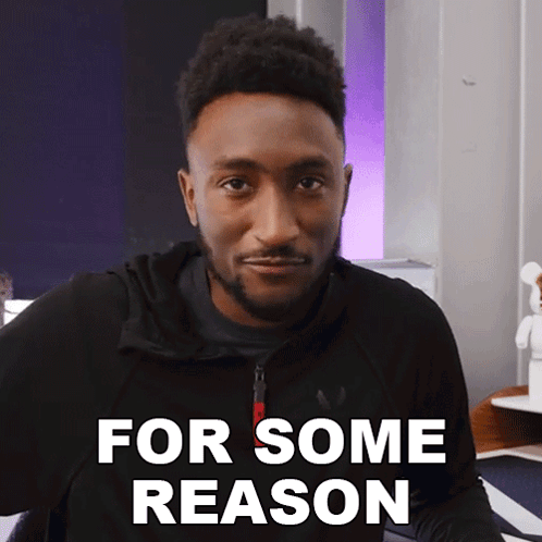 a man in a black jacket says " for some reason " in white letters