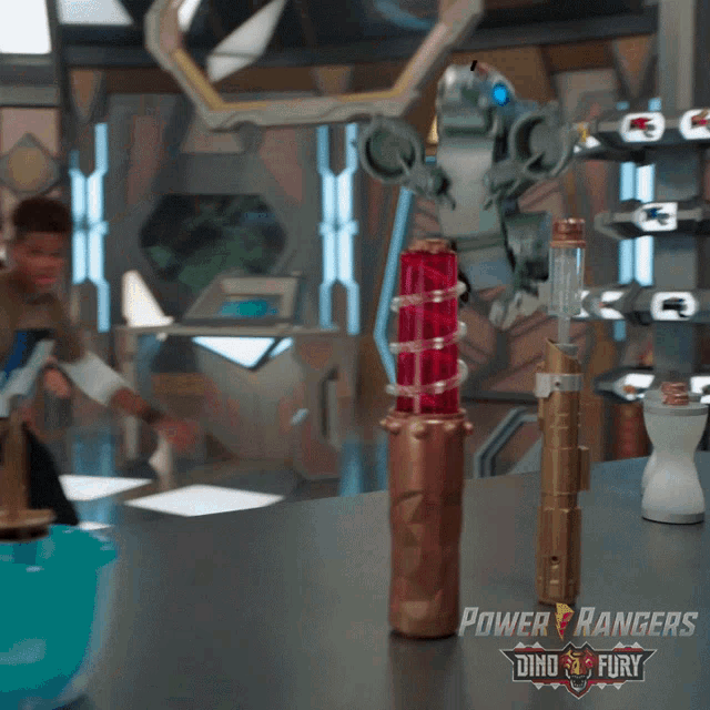 a power rangers poster with a robot and a bottle on a table