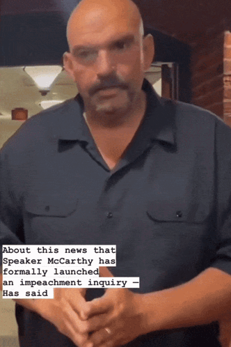 a bald man in a blue shirt is talking about the news that sneaker mccarthy has formally launched an impeachment inquiry