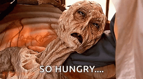 A wrinkled creature sits with the caption “SO HUNGRY…..”