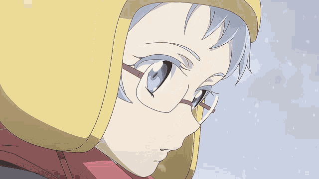 a close up of a person wearing glasses and a yellow hood
