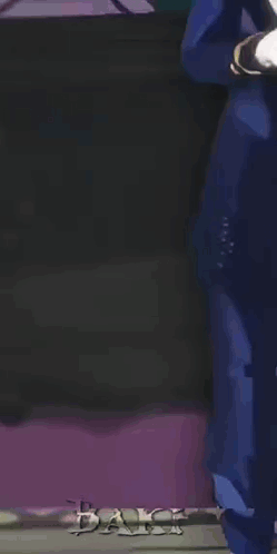 a man in a blue suit and purple shoes is standing with his hand on his chin
