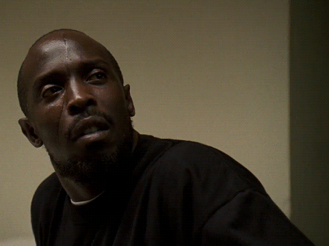 a close up of a man 's face with a scar on his forehead