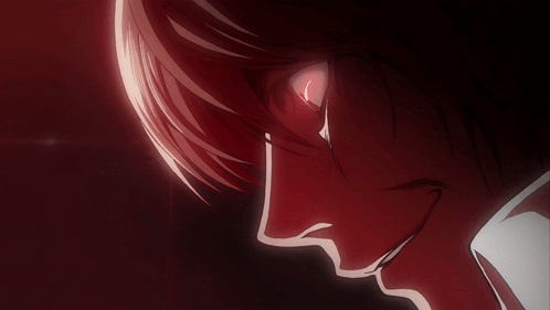 a close up of a man 's face with red eyes