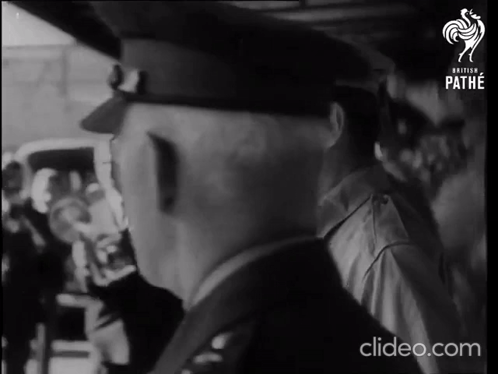 a black and white photo of a man with the word pathe on it