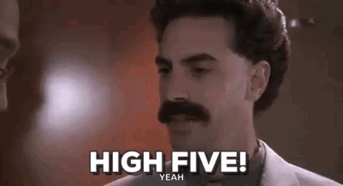 A mustached man smiles under the caption “HIGH FIVE!”
