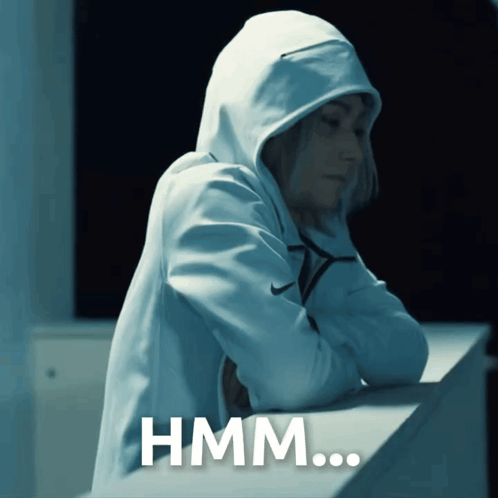 a person wearing a hooded sweatshirt with the word hmm written on it