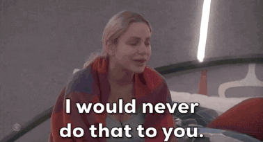 a woman wrapped in a plaid blanket says " i would never do that to you "