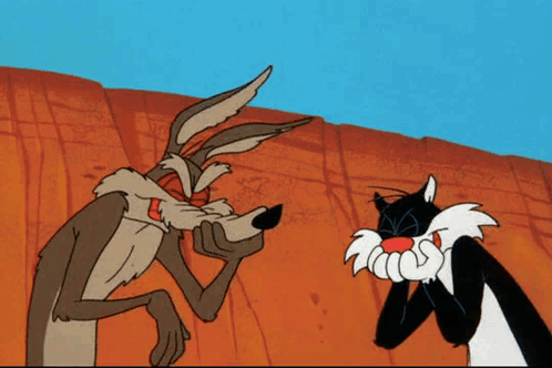 coyote and sylvester from the looney tunes cartoon are standing next to each other