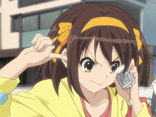 Haruhi Suzumiya holds a phone to her ear with a tense expression.