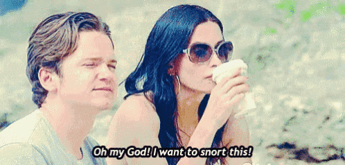 a man and a woman are sitting next to each other with the woman saying oh my god i want to snort this .
