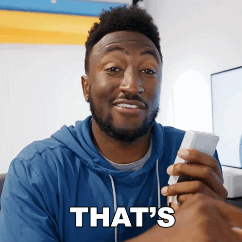 a man holding a cell phone with the words that 's on the bottom
