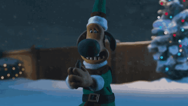 a cartoon dog wearing a santa hat is standing in the snow