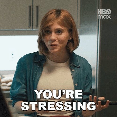 a woman says you 're stressing in front of a refrigerator