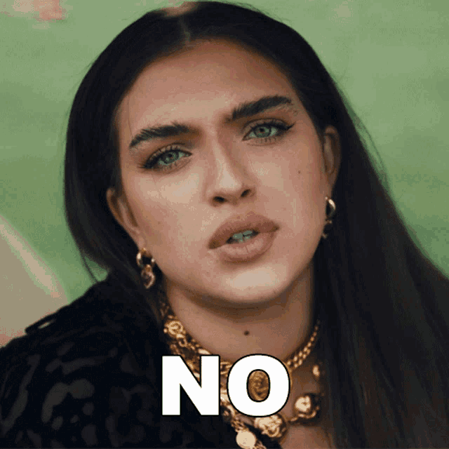 a close up of a woman 's face with the word no on the bottom right
