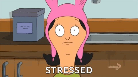 Louise Belcher stares with a twitchy, stressed expression in a classroom.
