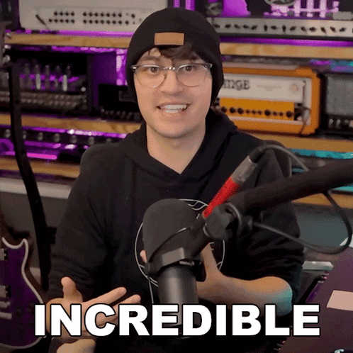 a man in front of a microphone with the word incredible on the bottom