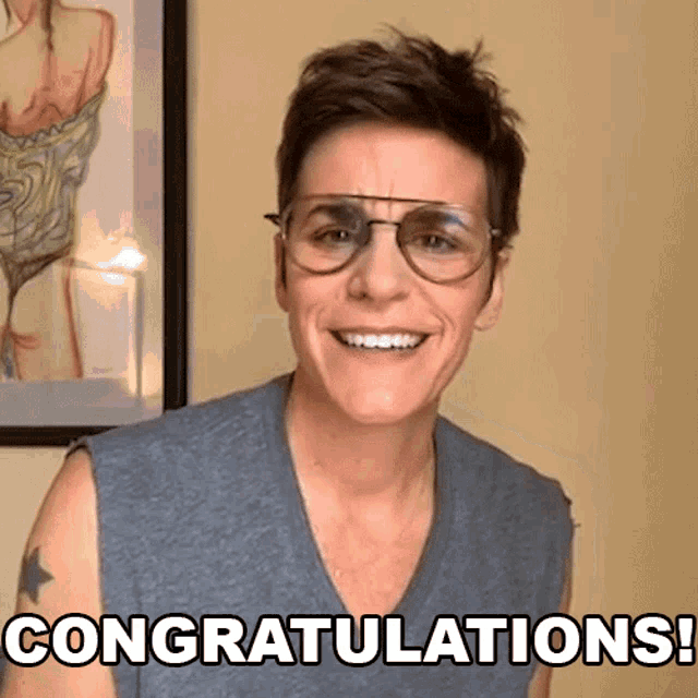 a woman wearing glasses says congratulations in front of a picture of a woman