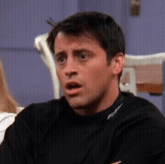 Joey Tribbiani looks shocked with a worried open-mouth expression.