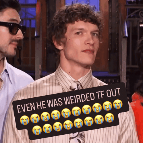 a man in a striped shirt and tie stands next to a sign that says even he was weirded tf out