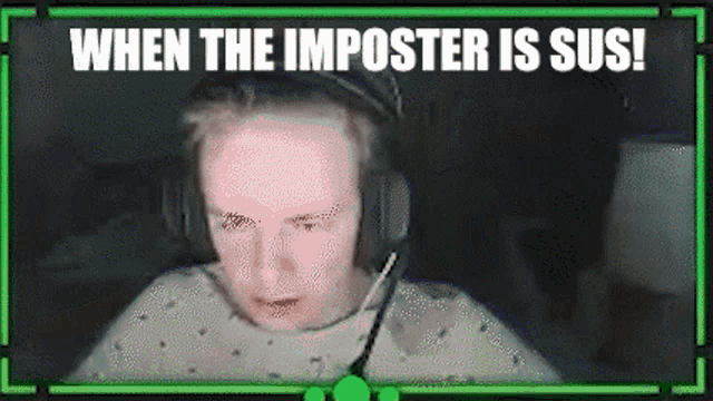 a man wearing headphones and a microphone is sitting in front of a green screen .