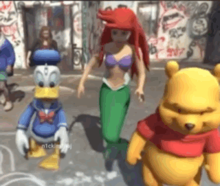 Donald Duck, Ariel, and Winnie the Pooh dance together.