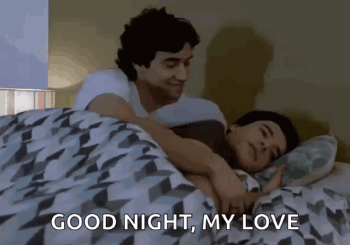 A live-action couple cuddles in bed with “GOOD NIGHT, MY LOVE.”