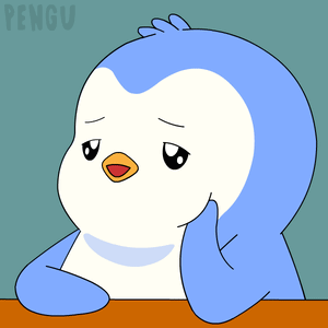 A blue cartoon penguin rests its cheek on a desk, looking sleepy.