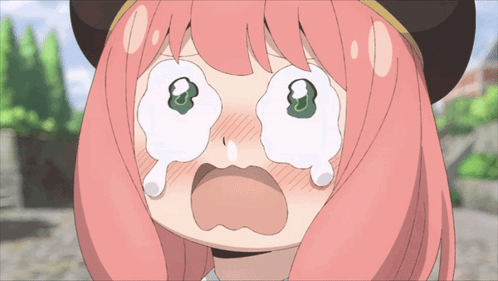 a girl with pink hair is crying with tears running down her face