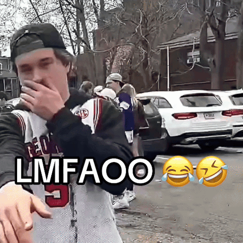 a man wearing a jersey that says lmfaoo covering his mouth
