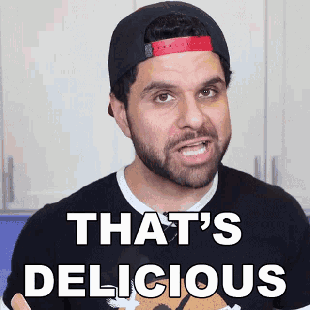 a man wearing a hat and a shirt that says that 's delicious on it