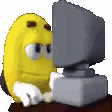 A pixelated yellow character reacts at a computer monitor.