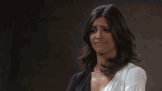a woman says " oh well " in front of her face