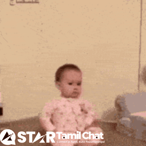 A small child stands indoors with a tense, upset expression.