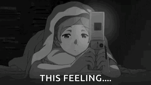 A grayscale anime character looks down at a phone beside caption “THIS FEELING....”