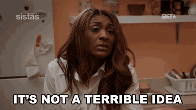 a woman says it 's not a terrible idea in front of a sistas refrigerator