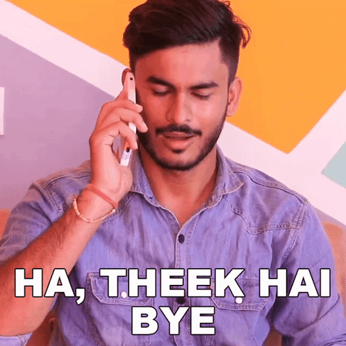 a man talking on a cell phone with the words ha theek hai bye behind him