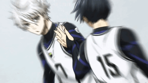 two basketball players are standing next to each other in a blurry photo .
