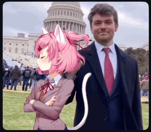 a man in a suit and tie is standing next to a girl with pink hair and cat ears
