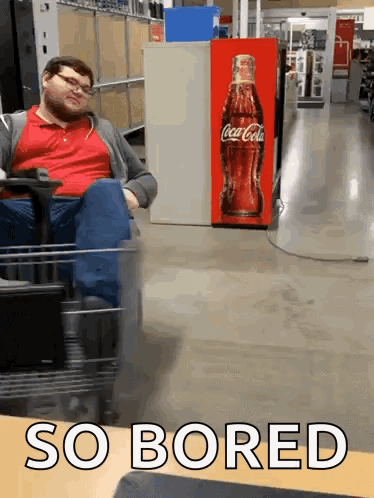 A person in a store aisle circles near a red vending machine under the caption “SO BORED.”