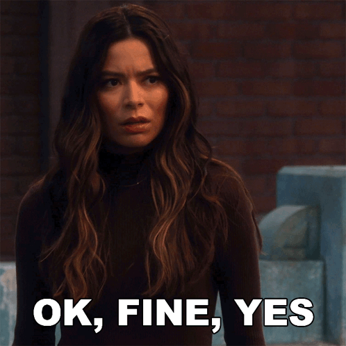 a woman says ok fine yes in front of a blue chair