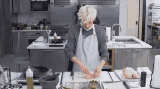 a man in an apron prepares food in a kitchen with imgflip.com at the bottom of the image