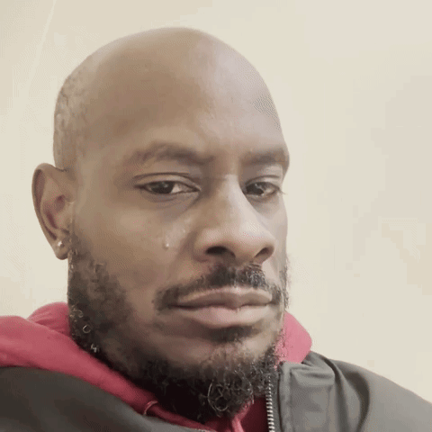 A man gives a skeptical, grossed-out side-eye toward the camera.